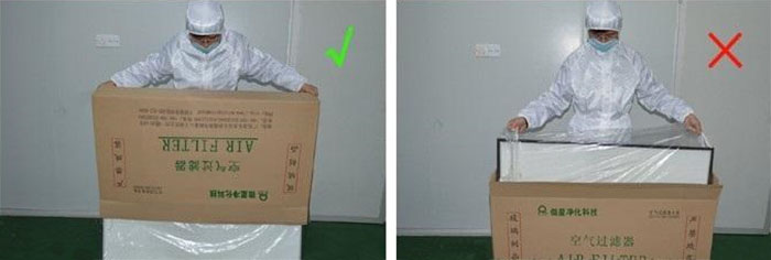 把高效过滤器慢慢倒出来，把纸箱放一边查看高效过滤器是否损坏